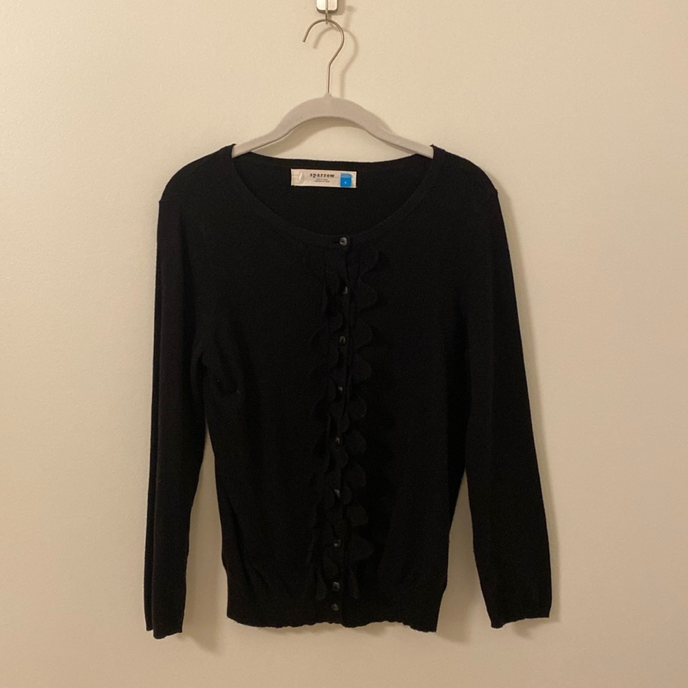 Cute black sweater with ruffle detail